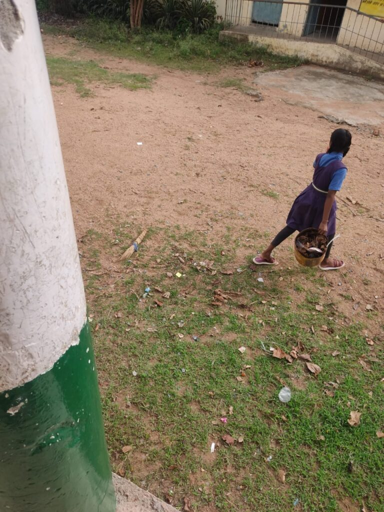 Children sweeping in school