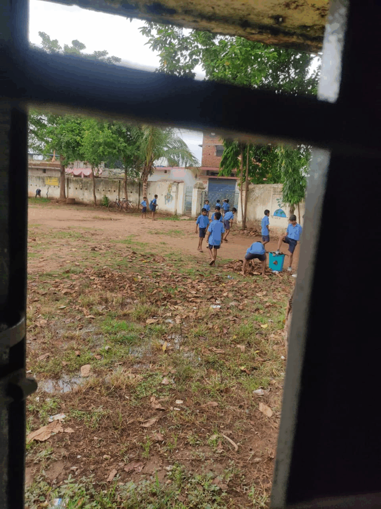 Children sweeping in school